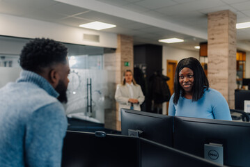 Programmers collaborating on software development project in modern office