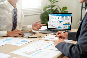 Businessman using computer to analyze SEO, search engine optimization, marketing, traffic ranking,...