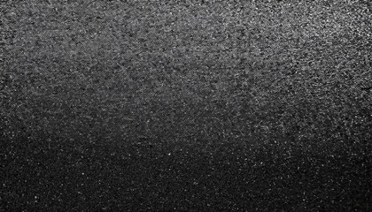 Fototapeta premium A black and white grainy background with dark noise texture, offering a monochrome abstract design, ideal for banners, posters, or headers with a minimalist and modern aesthetic. 