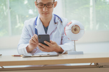 Male doctor specializing in eye diseases, providing consultations at a hospital, discussing eye...