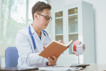 Male doctor specializing in eye diseases, providing consultations at a hospital, discussing eye...
