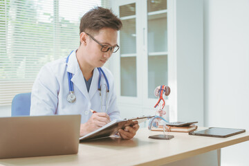 Male doctor treating male urinary tract diseases, providing consultations at a hospital,discussing...