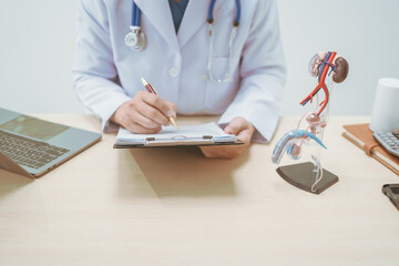 Male doctor treating male urinary tract diseases, providing consultations at a hospital,discussing...