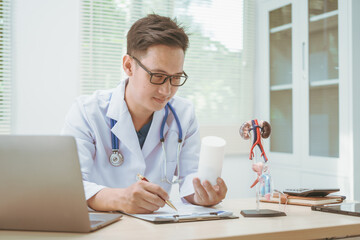 Male doctor treating male urinary tract diseases, providing consultations at a hospital,discussing...