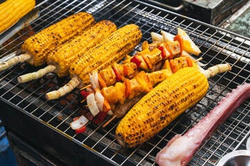 Fish and meat mix barbecue close up in South East Asian food market