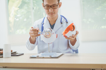 Male doctor specializing in eye diseases, providing consultations at a hospital, discussing eye...