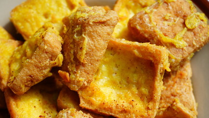 Close-Up of Crispy Fried Tofu with Golden Batter Coating