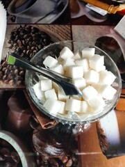 Sugar Cubes and Tongs on a Coffee Shop Table