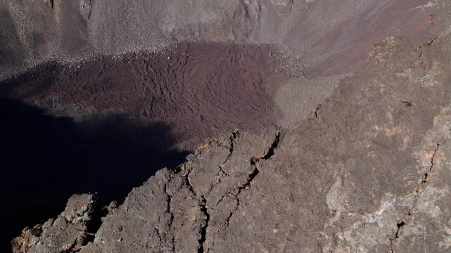Aerial view by drone of the Piton de la Fournaise, the Dolomieu crater, the Formica L&eacute;o volcanic cone and the Chapelle de Rosemont in the Fouqu&eacute; enclosure, Reunion Island