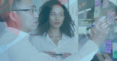 Image of financial data processing over diverse colleagues discussing work in office