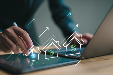 Real estate investment concept. Person using laptop with house icon and growth graph. Analyzing mortgage loan home and insurance real property mortgage. interest rate, Investment planning.