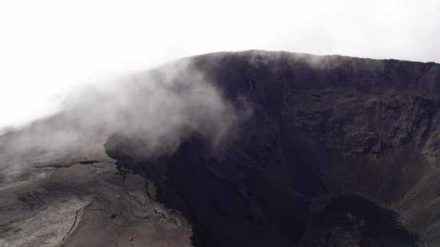 Aerial view by drone of the Piton de la Fournaise, the Dolomieu crater, the Formica L&eacute;o volcanic cone and the Chapelle de Rosemont in the Fouqu&eacute; enclosure, Reunion Island