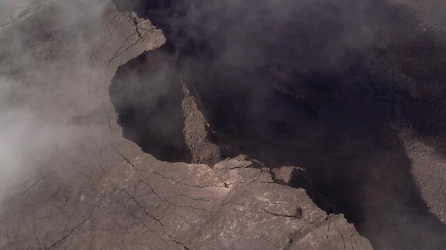 Aerial view by drone of the Piton de la Fournaise, the Dolomieu crater, the Formica L&eacute;o volcanic cone and the Chapelle de Rosemont in the Fouqu&eacute; enclosure, Reunion Island