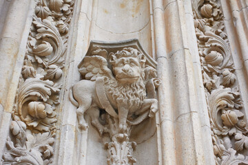 Winged lion sculpture in the Salamanca cathedralWinged lion sculpture on the Puerta de Ramos on the north facade of the cathedral of Salamanca, in Castile and Leon, Spain