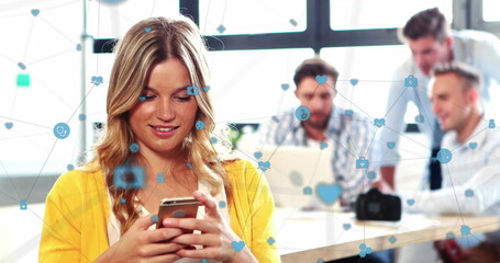 Image of network of connections with digital icons over caucasian businesswoman using smartphone