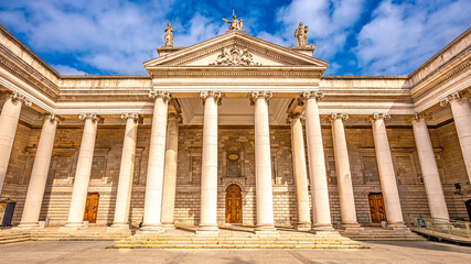 Neoclassical facade of the Bank of Ireland in Dublin with columns and statues