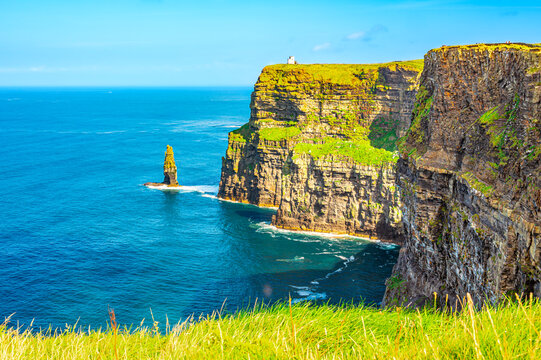 Scenic view of the Cliffs of Moher in Liscannor, Ireland with the Atlantic Ocean