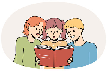 Children read book and are amazed at facts from history described in school encyclopedia. Boy and two pre-teen girls look with interest at book while visiting library or bookstore.