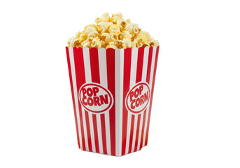 A red and white striped popcorn box filled with freshly popped corn, a few scattered kernels around the base, isolated on a white background