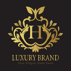 Luxury Gold Floral Letter Logo Design with Flourishes


