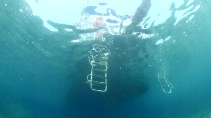 boy jumps in the sea from a boat underwater scenery