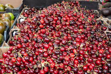 New season of ripe red sweet cherry summer fruits, cherry for sale on farmers market