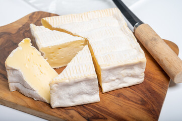French squared pont l'eveque cow cheese from Calvados department, Normandy, France
