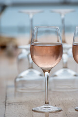 Summer time in Provence, two glasses of cold rose wine with blue sea view on background, French Riviera near Menton, south of France
