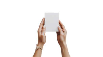 A pair of female hands delicately hold a blank white rectangular card against a black background providing a clean mockup for various applications.