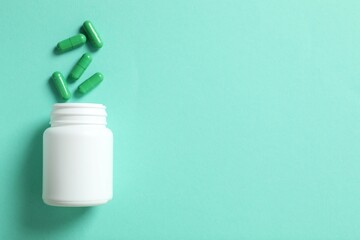 White bottle with pills on color background 