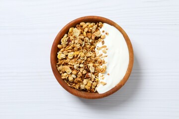  Delicious granola with yogurt on a light background