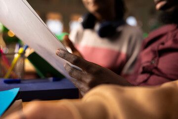 Scholars in a university library researching international business strategies, using reliable academic sources and studying materials to excel in finance with a management degree. Close up.