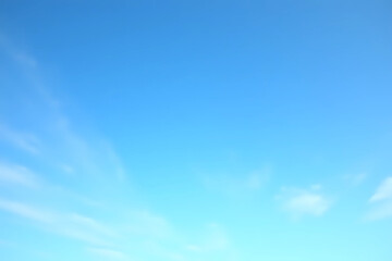 Obraz premium clear blue sky with a few clouds. The sky is very bright and the clouds are scattered throughout.