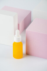 Plastic white tube for cream or lotion. Skin care or sunscreen cosmetic with stylish props on white background.