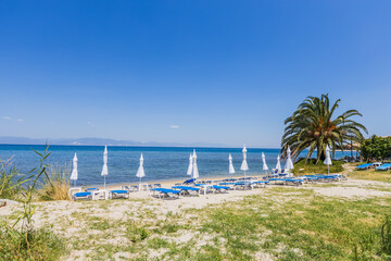 Picturesque sandy beach in Greece perfect summer vacation destination for relaxation by the sea.