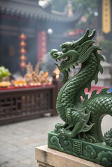 Fototapeta premium Green dragon statue outdoors at a cultural site