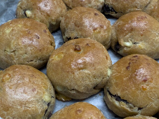 Healthy buns made from cottage cheese and spelled flour, baked in an electric oven and lightly brushed with butter.  The buns are filled with ground poppy seeds.