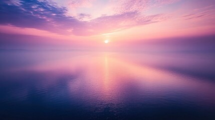 Fototapeta premium Serene sunrise over tranquil waters with soft pastel colors reflecting in the calm sea