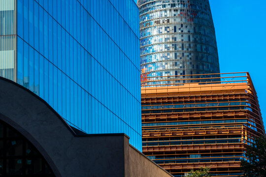 Modern skyscrapers, creating an abstract interplay of shapes, colors, and textures that challenge perceptions of architectural form in Poblenou in Barcelona