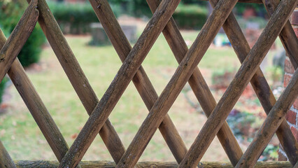 Old wooden fence in a cemetery.Close-up.