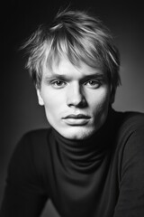 Fototapeta premium Black and white portrait of a young Russian man with intense gaze