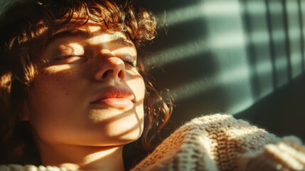 A peaceful portrait of a woman lying in soft light and shadows, reflecting a tranquil moment, capturing the essence of relaxation and natural beauty.