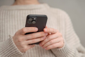 shot of woman looking at phone. Woman using technology. Technology content