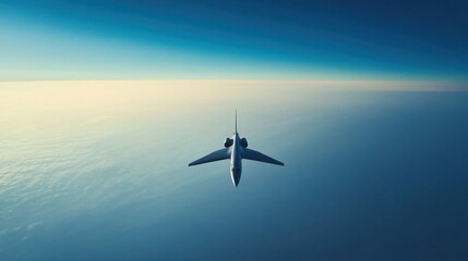 Jet airplane cruising above clouds at sunrise, aerial view