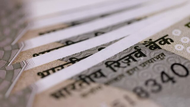 Tight close shot of Indian five hundred rupee notes. registering  Reserve Bank of India.