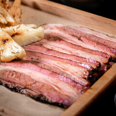 slice of Smoked Brisket on woodplate