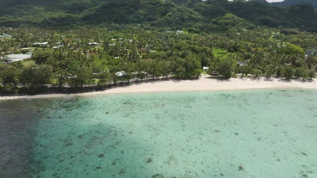 Drone high angle overview of Aroa Beach Lagoon Marine Reserve in South Pacific, Rarotonga Cook Islands with crystal clear waters