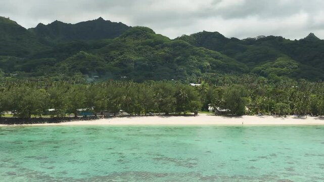 Drone tracking left of Aroa Beach Lagoon Marine Reserve in South Pacific, Rarotonga Cook Islands