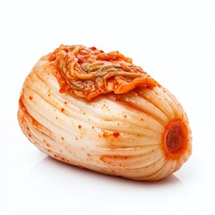 Fototapeta premium A single piece of kimchi, a Korean fermented cabbage dish, isolated on a white background.