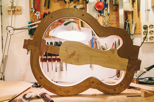 A detailed view of a bass guitar in progress